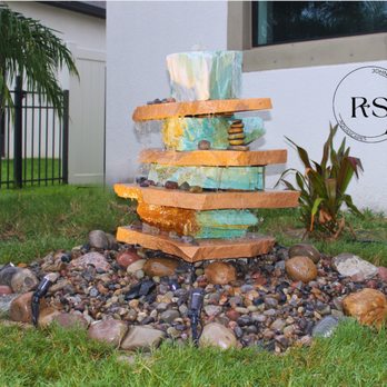 ROCK-IT SCIENCE SOLUTIONS - a water fountain in a garden - Landscaping Near Me ROCK-IT SCIENCE SOLUTIONS - a water fountain in a garden - Landscaping Near Me