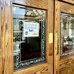 Nationwide Pack & Ship - Front entrance with authorized shipping sign for FedEx, DHL and UPS