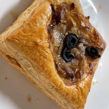 Epices Bakery - Onion olive Gruyère tart - Bakeries Near Me - New York, New York Epices Bakery - Onion olive Gruyère tart - Bakeries Near Me - New York, New York