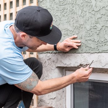 Tracker Home Inspections - Tracker Home Inspections inspecting broken parging on a home. - Home Inspectors Near Me Tracker Home Inspections - Tracker Home Inspections inspecting broken parging on a home. - Home Inspectors Near Me