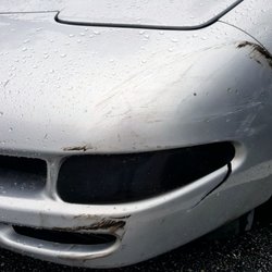 Hermans Auto Body - Damage from bring hit in parking lot.