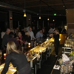 a crowd of people at a bar a crowd of people at a bar