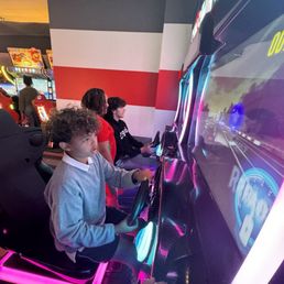 Kids enjoying their arcade time.