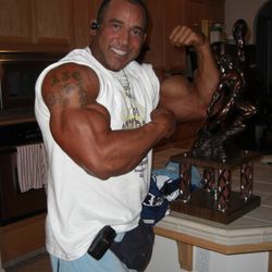 The Fit Factory - Champion Posing with the hardware