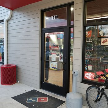 Domino's Pizza - a bicycle parked in front of a pizza parlor - Pizza Near Me - Dunedin, Florida Domino's Pizza - a bicycle parked in front of a pizza parlor - Pizza Near Me - Dunedin, Florida