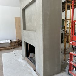 Drywall Solutions - Stucco fire place inside