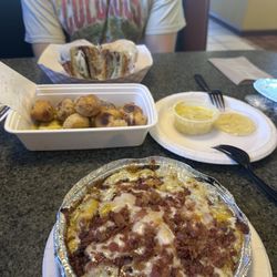 Garlic knots, cheddar bacon pasta, and baked steak sandwich!
