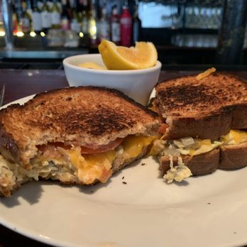 B Matthews Eatery - Omelette Sandwich! I had to take a bite before the photo! - New American Near Me - Savannah, Georgia