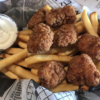 Henry's Bar & Grill - Chicken Chunk Basket ($12) served with French fries and a side of dressing. - Sports Bars Near Me - Cathedral City, California