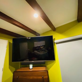 HD Custom Installations - Bedroom floating tv with sound bar attached - Home Theatre Installation Near Me - Buena Park, California