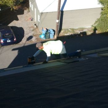 Zootown Construction - a man working on a roof - Roofing Near Me - Missoula, Montana Zootown Construction - a man working on a roof - Roofing Near Me - Missoula, Montana