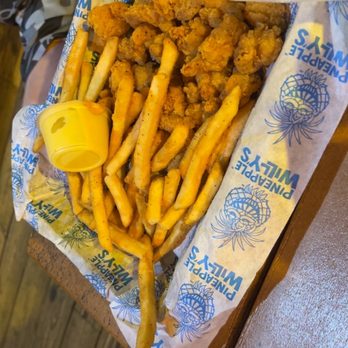 Pineapple Willy's - My nine-year-old said he wanted to feel like a big kid so he got the normal size popcorn shrimp basket - Seafood Near Me - Panama City Beach, Florida