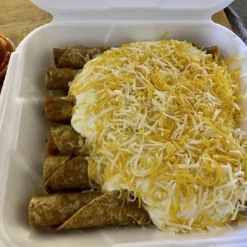 Albertaco's Mexican Food - 6 chicken rolled tacos with sour cream and shredded cheese. The shredded cheese is amazing here! Delicious! - Mexican Near Me - San Marcos, California