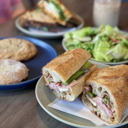 Ovenbird Bakery - Turkey & Havarti Sandwich Ham, Brie & Asparagus on Baguette Green Goddess Salad Iced Vanilla Latte Key Lime Thumbprint