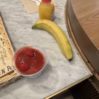 L'Ami Pierre - French Cafe - A banana, along with an orange juice and yogurt parfait. - French Near Me - New York, New York L'Ami Pierre - French Cafe - A banana, along with an orange juice and yogurt parfait. - French Near Me - New York, New York
