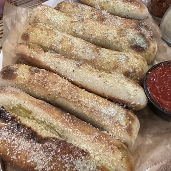 Flippers Pizza - a plate of breadsticks - Pizza Near Me - Orlando, Florida Flippers Pizza - a plate of breadsticks - Pizza Near Me - Orlando, Florida