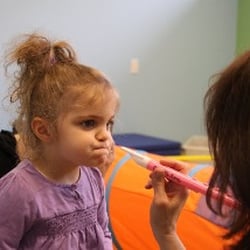 CLASS, Inc - One of our clients using a horn to increase breath control and focus on bilabials.
