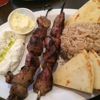 Santorini - Pork Souvlaki (kebab) with rice and herb yoghurt sauce (also with a side of their amazing garlic cream sauce...ask for it!). - Greek Near Me - Las Cruces, New Mexico Santorini - Pork Souvlaki (kebab) with rice and herb yoghurt sauce (also with a side of their amazing garlic cream sauce...ask for it!). - Greek Near Me - Las Cruces, New Mexico
