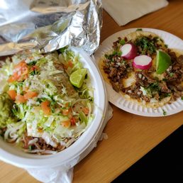 Carne asada burrito left and 4 carne asada tacos right Carne asada burrito left and 4 carne asada tacos right