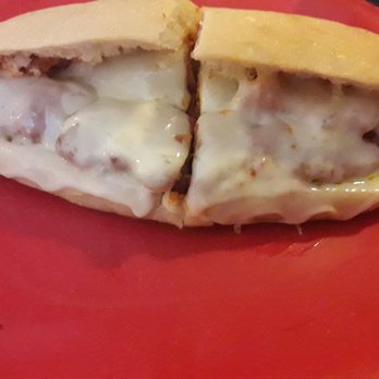 Original Italian Pizza - a half eaten sandwich on a red plate - Italian Near Me - Millheim, Pennsylvania Original Italian Pizza - a half eaten sandwich on a red plate - Italian Near Me - Millheim, Pennsylvania