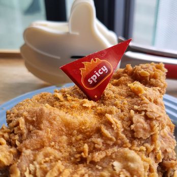 Jollibee - a piece of fried chicken on a blue plate - Chicken Shop Near Me - Toronto, Ontario