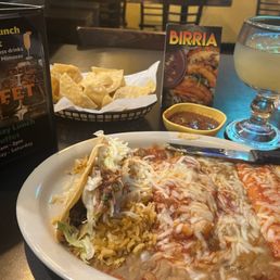 trio taco, enchilada and chile relleno rice beans chips salsa and refreshment