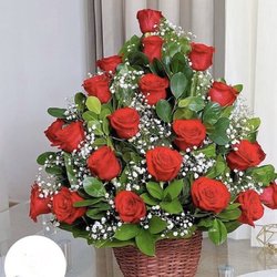 Carol's Flowers and Decoraciones - A basket with two dozen of roses available in different colors