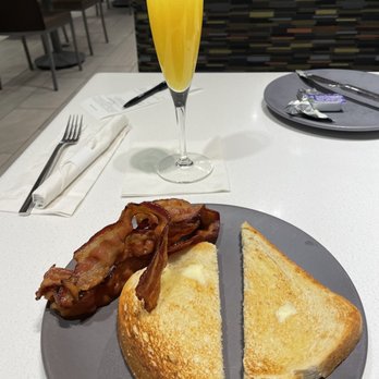 Harbor Grille - Bacon, sour dough toast and fresh squeezed mimosa! - Sports Bars Near Me - Baltimore, Maryland