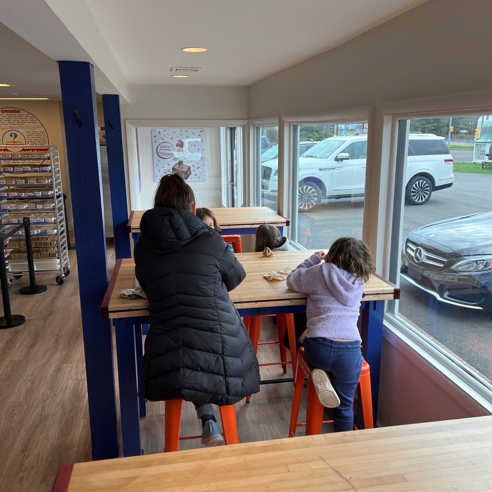 Curiosity Doughnuts - a woman and a child sitting at a table - Donuts Near Me - Furlong, Pennsylvania Curiosity Doughnuts - a woman and a child sitting at a table - Donuts Near Me - Furlong, Pennsylvania