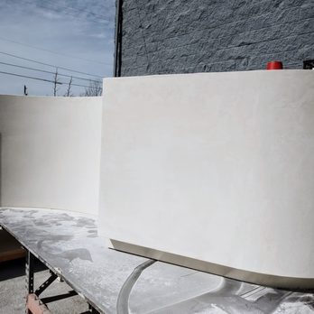 Star Strata - a white bench in front of a building - General Contractors Near Me Star Strata - a white bench in front of a building - General Contractors Near Me