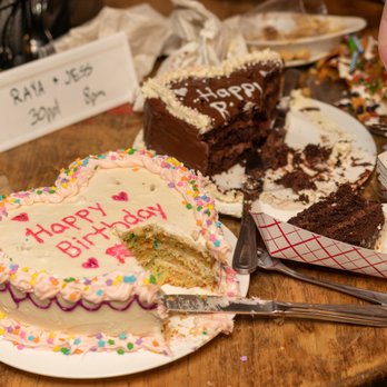 e's BAR - a birthday cake with a slice taken out of it - Bars Near Me - New York, New York