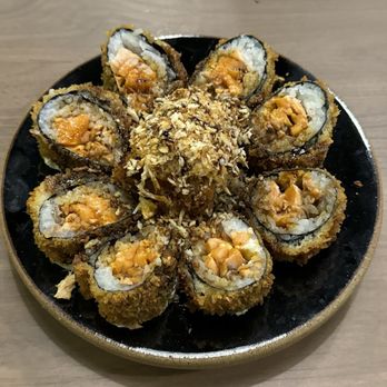 X Sushi - Volcano Roll - Deep Fried Roll with Salmon and Cream Cheese. Topped with Snow Crab, tempura Flakes and House made Eel Sauce. - Sushi Bars Near Me - Winter Garden, Florida X Sushi - Volcano Roll - Deep Fried Roll with Salmon and Cream Cheese. Topped with Snow Crab, tempura Flakes and House made Eel Sauce. - Sushi Bars Near Me - Winter Garden, Florida