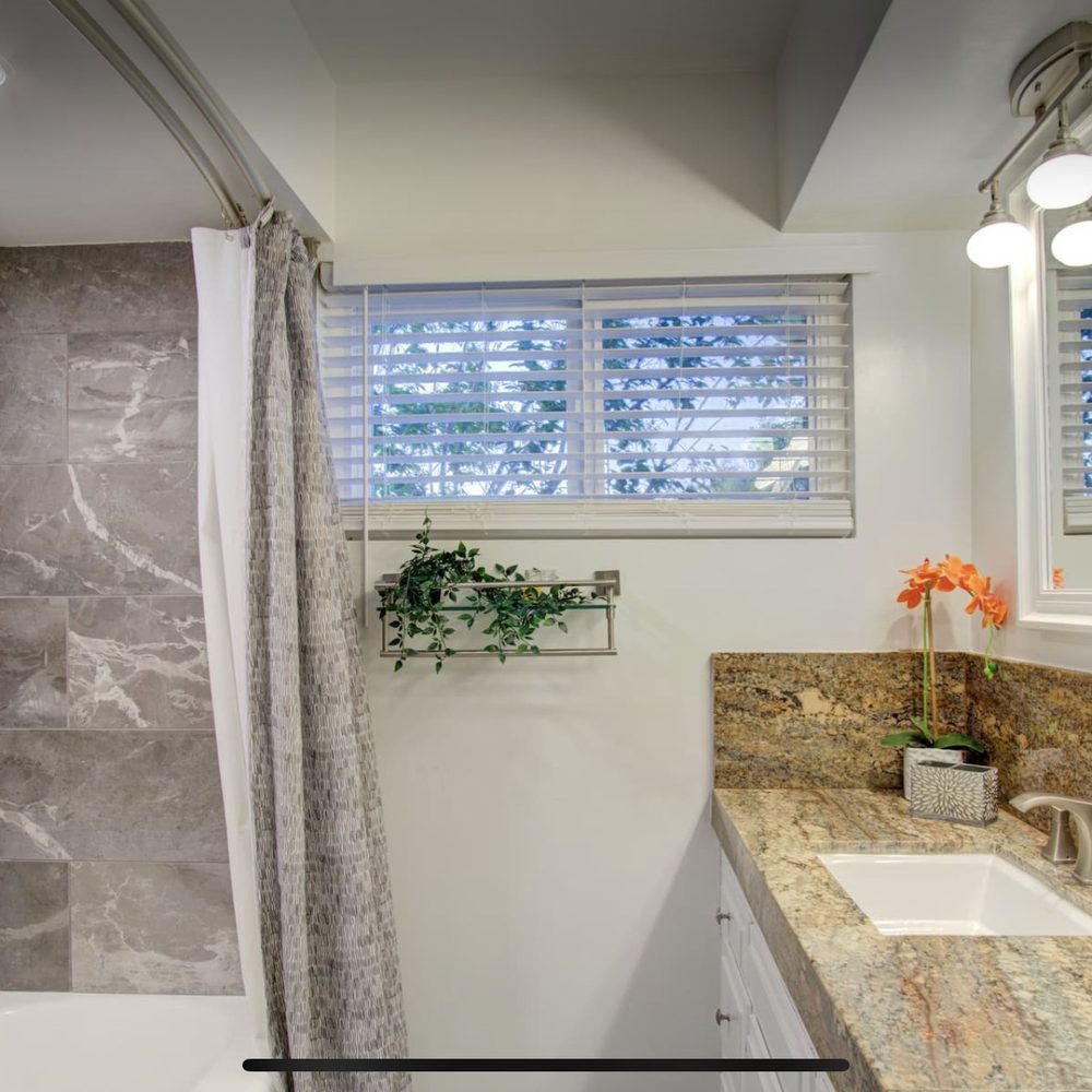 TG Designs - a bathroom with a marble counter top - General Contractors Near Me - San Diego, California TG Designs - a bathroom with a marble counter top - General Contractors Near Me - San Diego, California