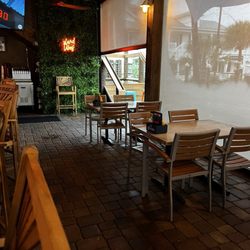 Tortuga's Kitchen & Bar - Plastics covering racing open areas.