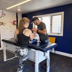 Evolution Chiropractic - Mom and baby in care.