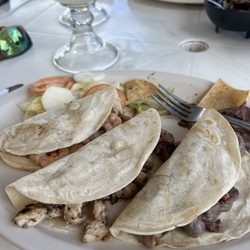 Señor Iguanas Restaurant and Cantina - Shrimp chicken and beef tacos.  Came with guacamole and beans