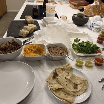 Carnitas Uruapan - Dinner for two Carnitas + Ranchero burrito in the back. So epic, so delicious!! - Mexican Near Me - San Diego, California