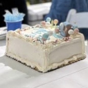 Mazzetti's Bakery - Derby cake - A rectangular cake with white frosting, decorated with pastel candies, sprinkles, and a small blue paper cup on top. - Bakeries Near Me - Pacifica, California