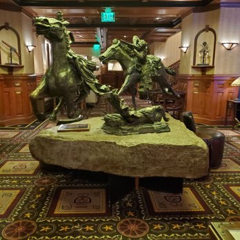 The Driskill Bar - The Widowmaker statue! - Lounges Near Me - Austin, Texas
