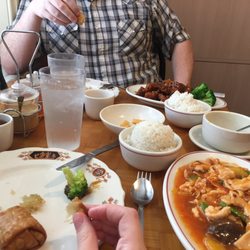 Dried ginger mango chicken and general tso's chicken. Egg roll on the left. Big pot of jasmine tea comes with everything.