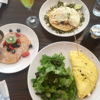 Maplewood Kitchen and Bar - Clockwise from the top: chicken tinga, maplewood omelette, and side order of lemon ricotta pancakes - Breakfast & Brunch Near Me - Cincinnati, Ohio Maplewood Kitchen and Bar - Clockwise from the top: chicken tinga, maplewood omelette, and side order of lemon ricotta pancakes - Breakfast & Brunch Near Me - Cincinnati, Ohio