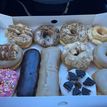 Randy's Donuts - 2 Maple Raised, Glazed Old Fashioned, Coffee Raised, 2 Cinnamon Toast Crunch Raised, Oreos Raised, Blueberry Cake,Maple Raised with Churros - Donuts Near Me - Riverside, California
