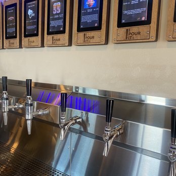 The Thirsty Cow Taphouse - a row of beer taps - Beer Bar Near Me - Baileys Harbor, Wisconsin The Thirsty Cow Taphouse - a row of beer taps - Beer Bar Near Me - Baileys Harbor, Wisconsin