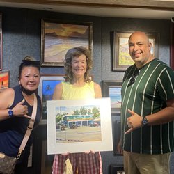 Artist Lynn Boyer with the Kalapawai Market print we bought