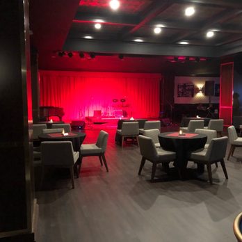 Roaring Social - The stage, piano and cocktail tables. - Venues & Event Spaces Near Me - Alpharetta, Georgia Roaring Social - The stage, piano and cocktail tables. - Venues & Event Spaces Near Me - Alpharetta, Georgia