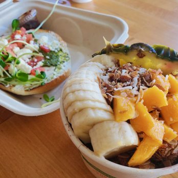 Java Kai Kauai - Cream cheese, tomato, pesto bagel in the back. Acai bowl up front - Breakfast & Brunch Near Me - Kapaa, Hawaii