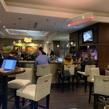 Blue Water Grill - people sitting at tables with laptops - Pubs Near Me - Bloomington, Minnesota