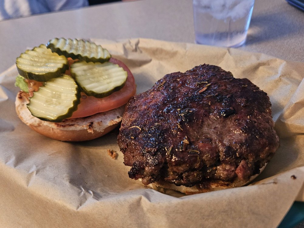 The Pickle Nickel Logo