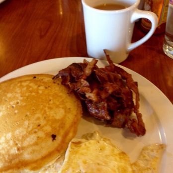 Hellas Carryout - 2 pancakes, 2 over medium eggs& and 2+ pieces of bacon. What a great breakfast! - Delis Near Me - Powell, Ohio