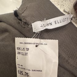 Ripped shirt overuse of plastic tags on something so simple not to mention it was $25!!!